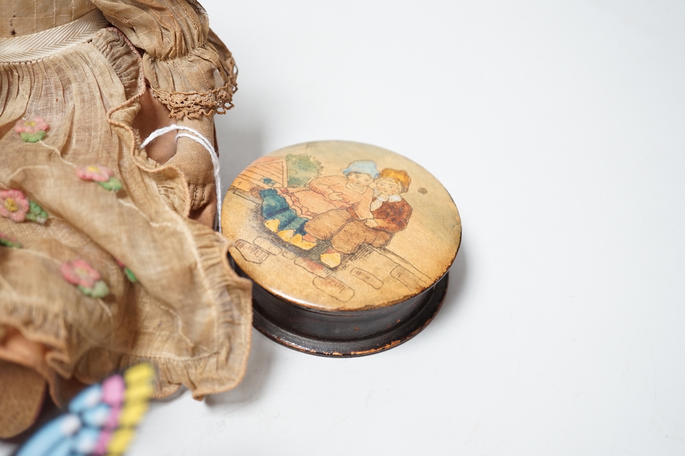 Two tin plate clockwork toys, a doll and a treen box